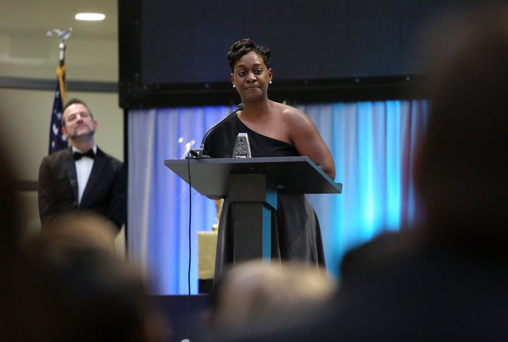 Diamond Kelley, a Woodmore Elementary School teacher, says a few words of thanks after she is honored for winning the Excellence in Passionate Practice award during the OZcars Gala Friday, May 10, 2019 at Unum in Chattanooga, Tennessee. Kelley was one of three teachers given excellence awards during the event. The other awards given out were for instruction and relationship.