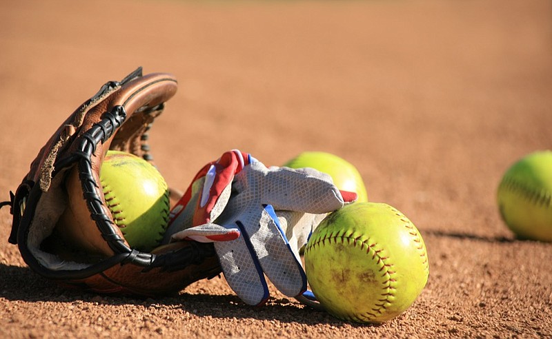 Softball Baseball balls and batters glove softball tile / Getty Images