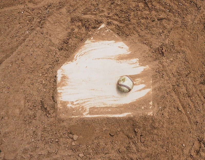 
Baseball laying with homeplate on dirt field for game. baseball tile diamond / Getty Images