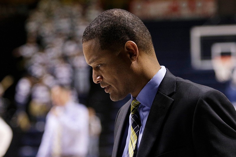 Chattanooga men's basketball coach Lamont Paris leaves the court after warmups before the Mocs' SoCon basketball game against the Furman Paladins at McKenzie Arena on Saturday, March 2, 2019, in Chattanooga, Tenn. 