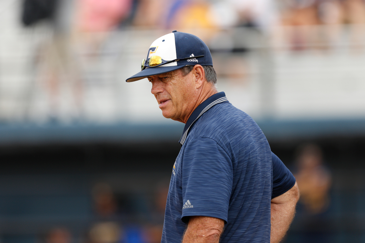 Chattanooga softball coach Frank Reed stands in the coach's box during the Mocs' SoCon softball championship game against the UNCG Spartans at Frost Stadium on Saturday, May 11, 2019, in Chattanooga, Tenn.