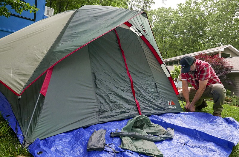 Rick Jones from Anderson, South Carolina sets up his tent for the night.