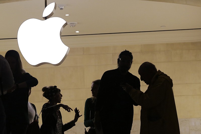 FILE- In this May 31, 2018, file photo customers enter the Apple store in New York. The Supreme Court is allowing consumers to pursue an antitrust lawsuit that claims Apple has unfairly monopolized the market for the sale of iPhone apps. (AP Photo/Mark Lennihan, File)