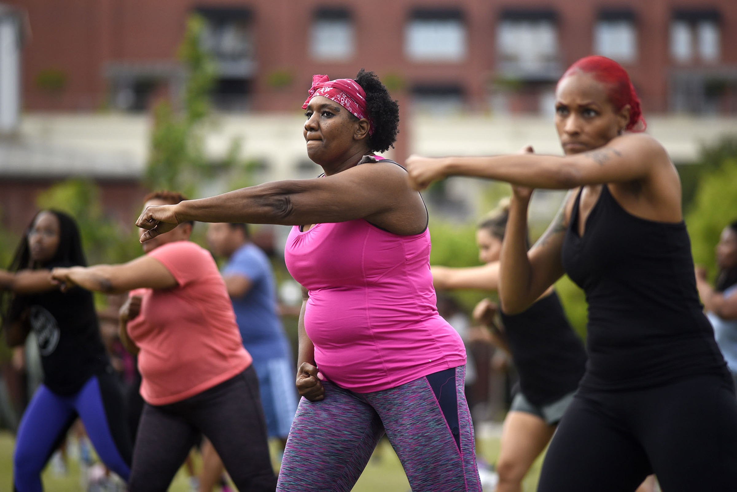 Participants work on their punches. Cempa Community Care and Hospice of Chattanooga hosted the Third Neighborhood Workout Jam Session at Miller Park on May 13, 2019. Mayor Andy Berke addressed the participants.