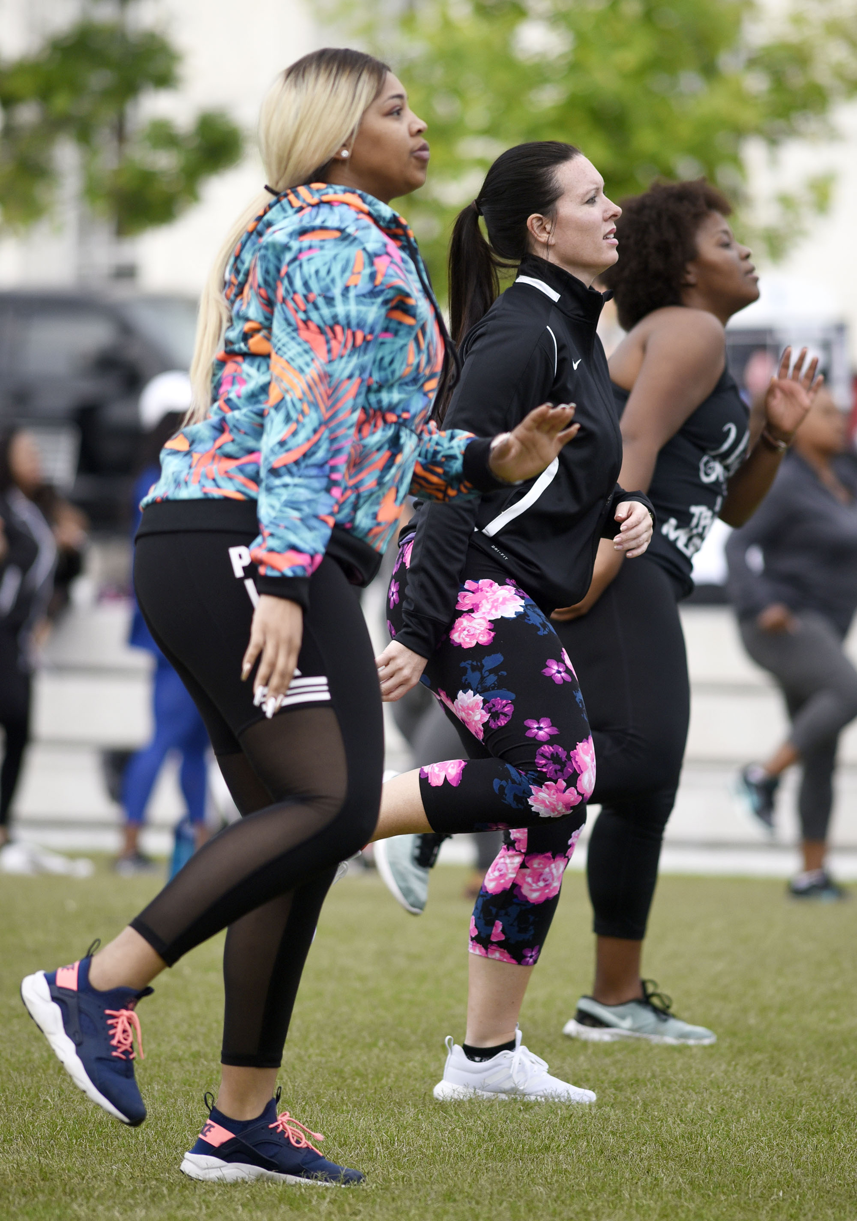 Fitness enthusiasts follow the lead of instructor Tobe Taylor. Cempa Community Care and Hospice of Chattanooga hosted the Third Neighborhood Workout Jam Session at Miller Park on May 13, 2019. Mayor Andy Berke addressed the participants.