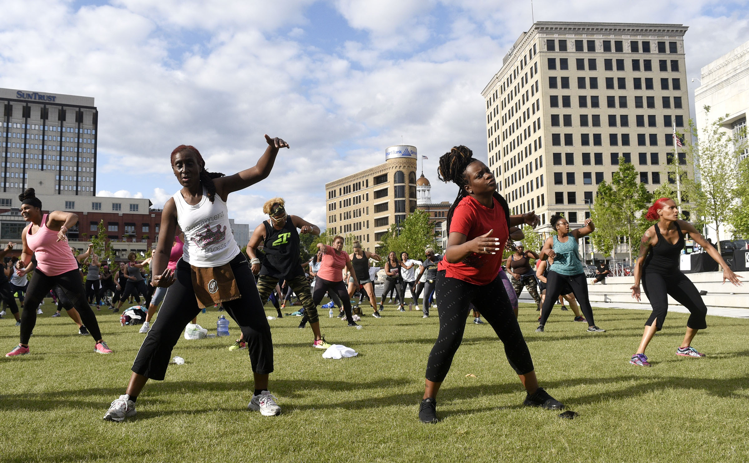 Exercisers fill the green at Miller Park as they workout. Cempa Community Care and Hospice of Chattanooga hosted the Third Neighborhood Workout Jam Session at Miller Park on May 13, 2019. Mayor Andy Berke addressed the participants.