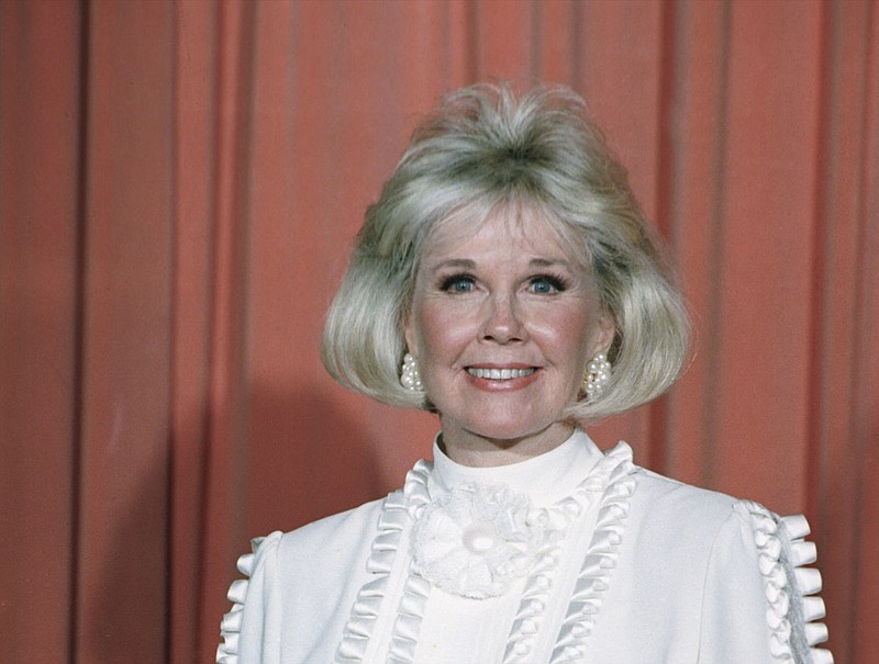 In this Jan. 28, 1989 file photo, actress and animal rights activist Doris Day poses for photos after receiving the Cecil B. DeMille Award she was presented with at the annual Golden Globe Awards ceremony in Los Angeles. Day, whose wholesome screen presence stood for a time of innocence in '60s films, has died, her foundation says. She was 97. The Doris Day Animal Foundation confirmed Day died early Monday, May 13, 2019, at her Carmel Valley, California, home. (AP Photo, File)