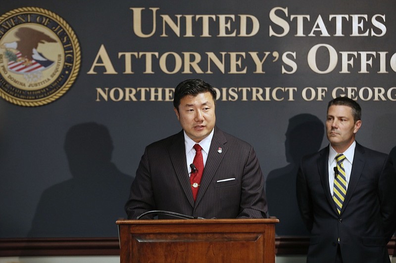 U.S. Attorney Byung J. "BJay" Pak, at the podium next to Chris Hacker, Special Agent in Charge of FBI Atlanta, announces that Georgia Insurance Commissioner Jim C. Beck has been indicted by a federal grand jury on charges of wire fraud, mail fraud and money laundering, Tuesday, May 14, 2019 in Atlanta. (Bob Andres/Atlanta Journal-Constitution via AP)

