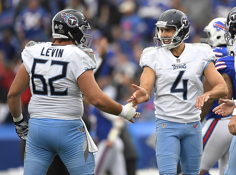 Tennessee Titans kicker Ryan Succop (4) celebrates a field goal with guard Corey Levin during the first half of a road game against the Buffalo Bills in October 2018. Levin, a former UTC player and Georgia native, is preparing for his third season with the Titans and was among the players who visited Chattanooga on Wednesday as part of the NFL team's caravan stop.