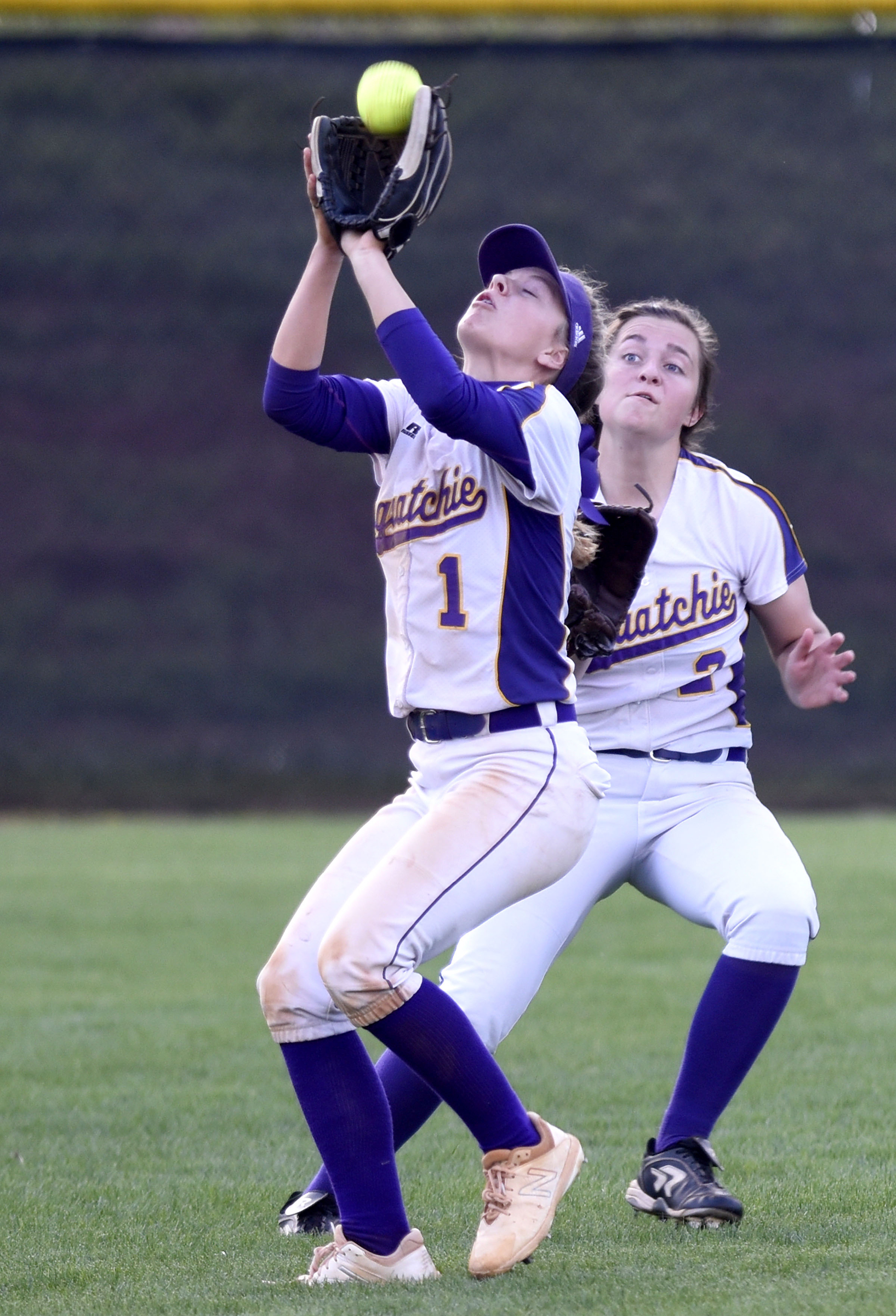 Sequatchie County's Ella Edgmon (1) pulls in a short fly ball in front of left fielder Jadeyn Girdley (2). The Marion County Lady Warriors defeated the Sequatchie County Lady Indians 6-5 in the Region 4-AA championship at Sequatchie County High on May 15, 2019.