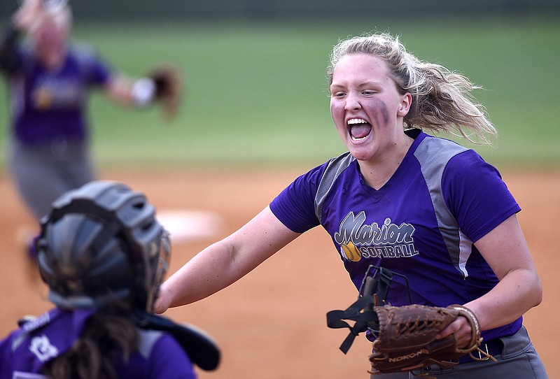 Marion County pitcher Sara Muir celebrates the final out as she runs to embrace catcher Savannah Thomas after the Lady Warriors beat host Sequatchie County 6-5 in the Region 4-AA championship game Wednesday night.