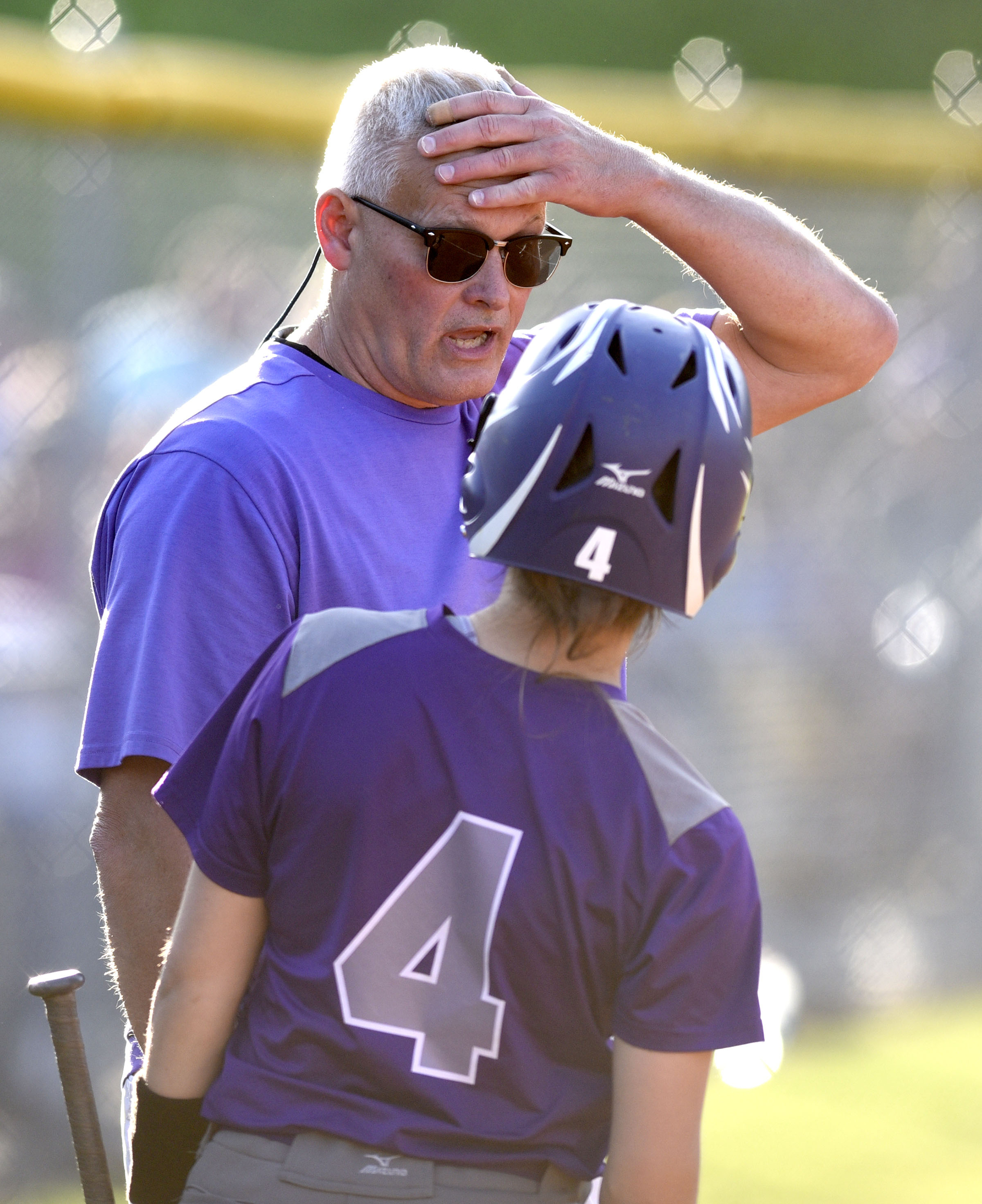 Marion County head coach Randy Ellis confers with Savannah Parker (4) before Parkers two-run double. The Marion County Lady Warriors defeated the Sequatchie County Lady Indians 6-5 in the Region 4-AA championship at Sequatchie County High on May 15, 2019.