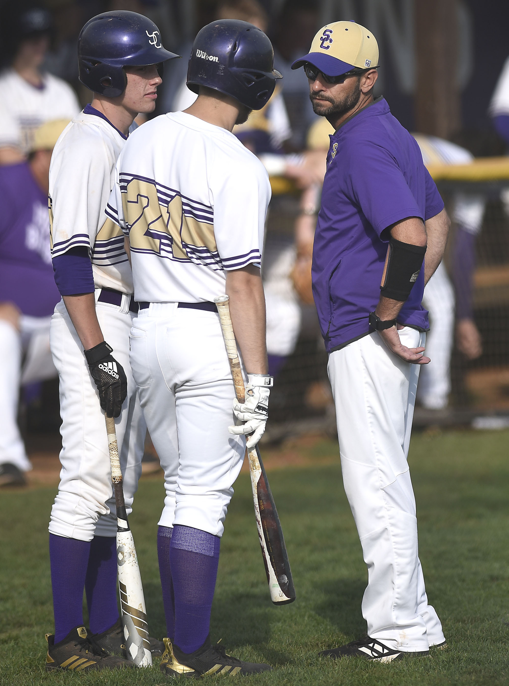 Sequatchie head coach Derrin Easterly confers with Tyler Lynn (21) and another player. The Sequatchie County Indians hosted the Grundy County Yellow Jackets in the Region 4-AA baseball championship on May 15, 2019.