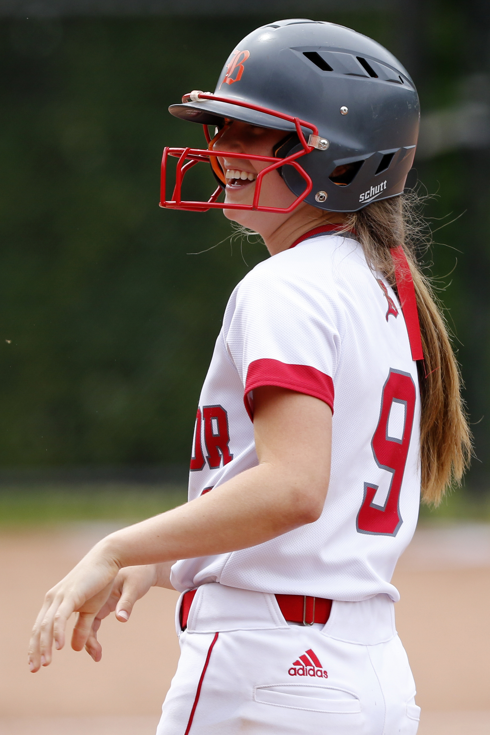 Baylor's Britt Barton (9) laughs at first base in the bottom of the second inning during Game 1 of a doubleheader in the Division II-AA quarterfinals against St. Cecilia Academy at Baylor School on Wednesday, May 15, 2019 in Chattanooga, Tenn. Baylor won 16-0 in three innings.