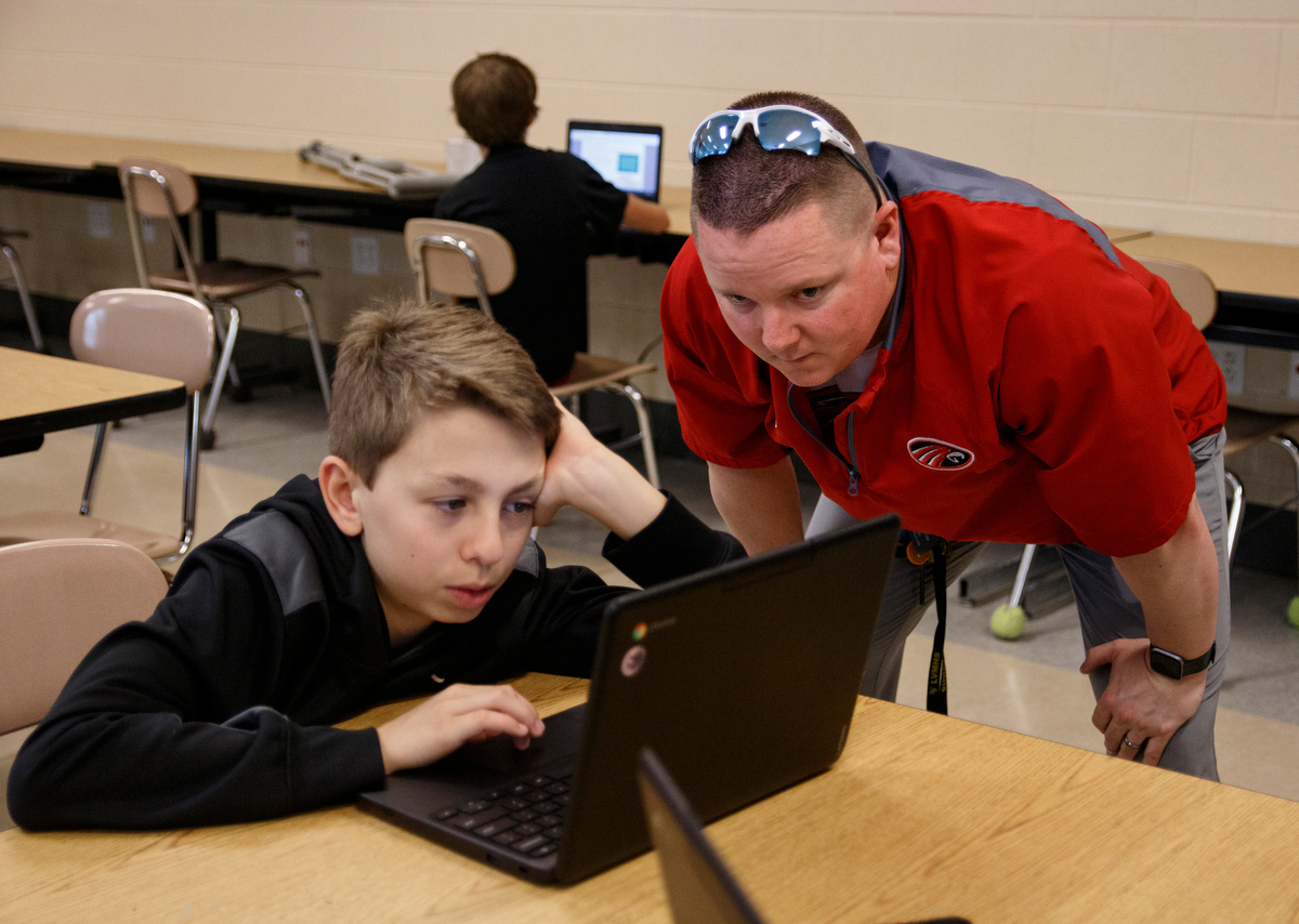Teacher Joshua Payne, right, helps Nicolas Johnson as he completes a Learning Blade exercise in a 7th grade STEM innovators class at Signal Mountain Middle High School on Thursday, May 9, 2019, in Signal Mountain, Tenn. Learning Blade presented a 3D printer to the school for their achievement using the Learning Blade program.