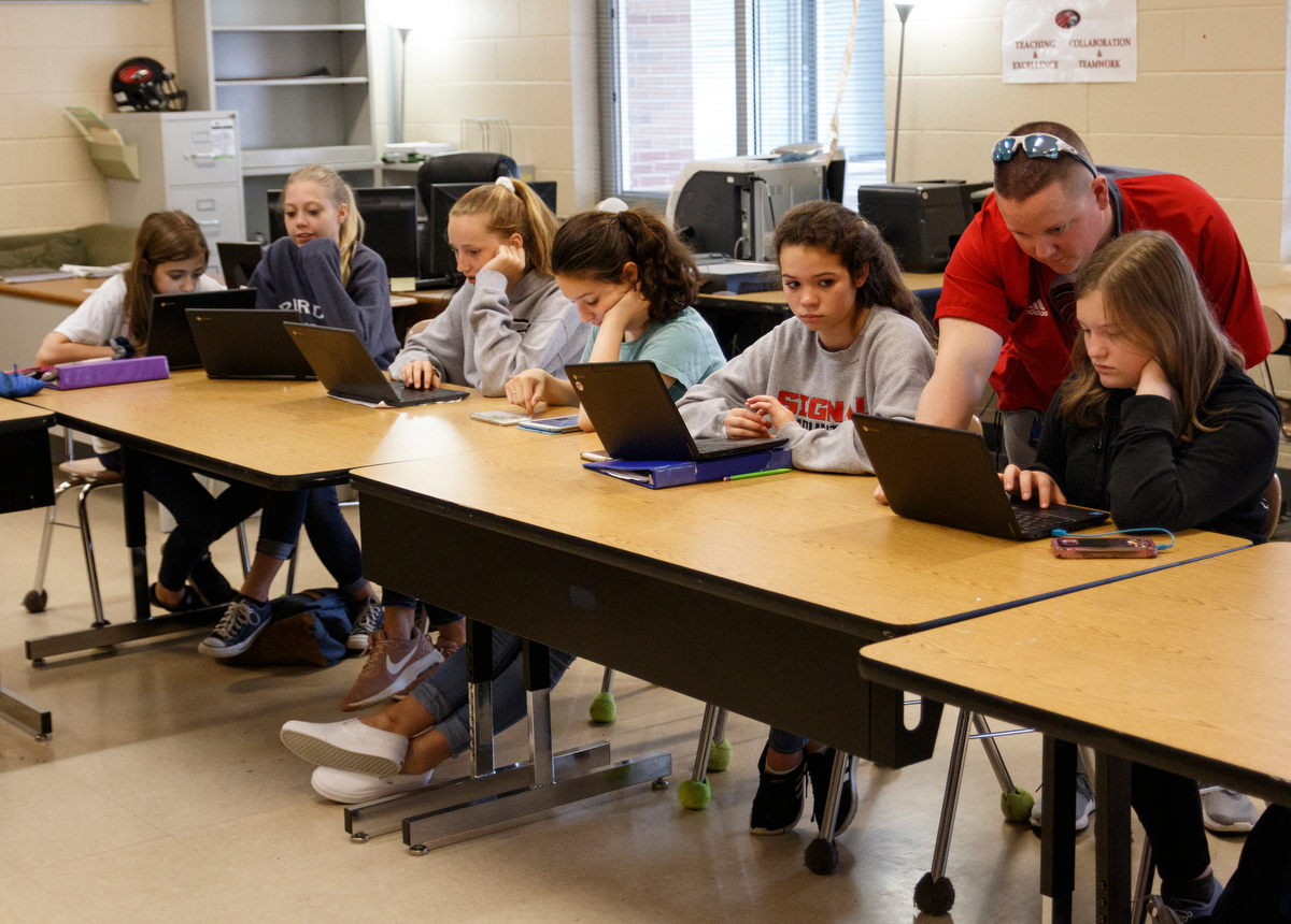 Teacher Joshua Payne helps students as they complete Learning Blade exercises in a 7th grade STEM innovators class at Signal Mountain Middle High School on Thursday, May 9, 2019, in Signal Mountain, Tenn. Learning Blade presented a 3D printer to the school for their achievement using the Learning Blade program.