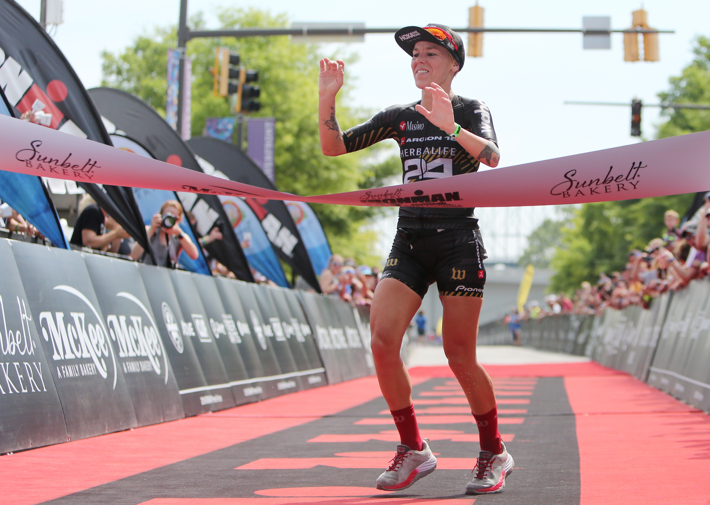 Heather Jackson crosses the finish line in first place during Ironman 70.3 Chattanooga Sunday, May 20, 2018 in Chattanooga, Tenn. Jackson finished with a time of 4:11:08.