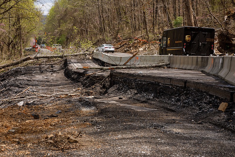 Staff photo by Doug Strickland / a collapsed portion of U.S. Highway 41 between Haletown in Marion County and Tiftonia in Hamilton County on Tuesday, April 2, 2019, near Chattanooga, Tenn. TDOT has constructed a temporary one-lane road with traffic signals to bypass the collapsed portion of road.