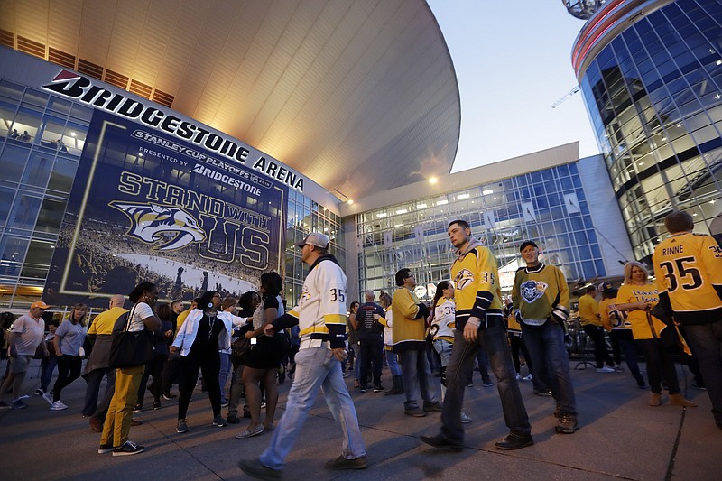 Fans arrive at Bridgestone Arena for a playoff game between the host Nashville Predators and the Dallas Stars last month.