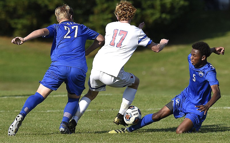 Staff photo by Robin Rudd / McCallie's Neal Carlson (27) and Jonathan Richardson, sliding in against Memphis University School's Lucio Rosa (17), defend during a home playoff game on May 16, 2019.