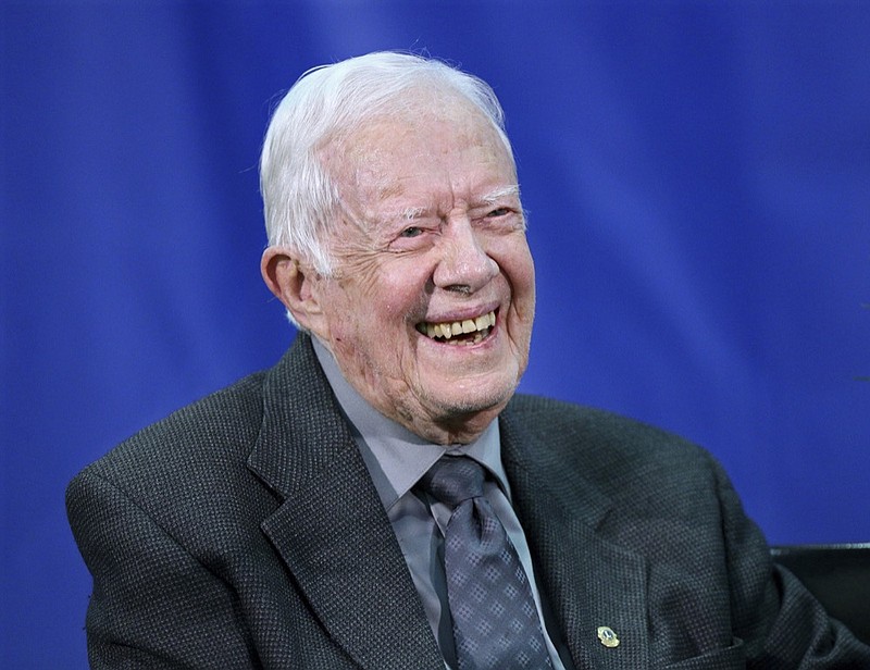 FILE- In this Sept. 12, 2018, file photo former President Jimmy Carter answers questions from students during his annual town hall with Emory University in Atlanta. Carter has been released from a Georgia hospital after hip replacement surgery. A spokeswoman for Carter says former first lady Rosalynn Carter also was hospitalized Wednesday, May 15, 2019, in Americus after feeling faint but was discharged Thursday, May 16 along with her husband. The 94-year-old former president injured his hip earlier this week when he fell at his home before a planned turkey hunt. (Curtis Compton/Atlanta Journal-Constitution via AP, File)

