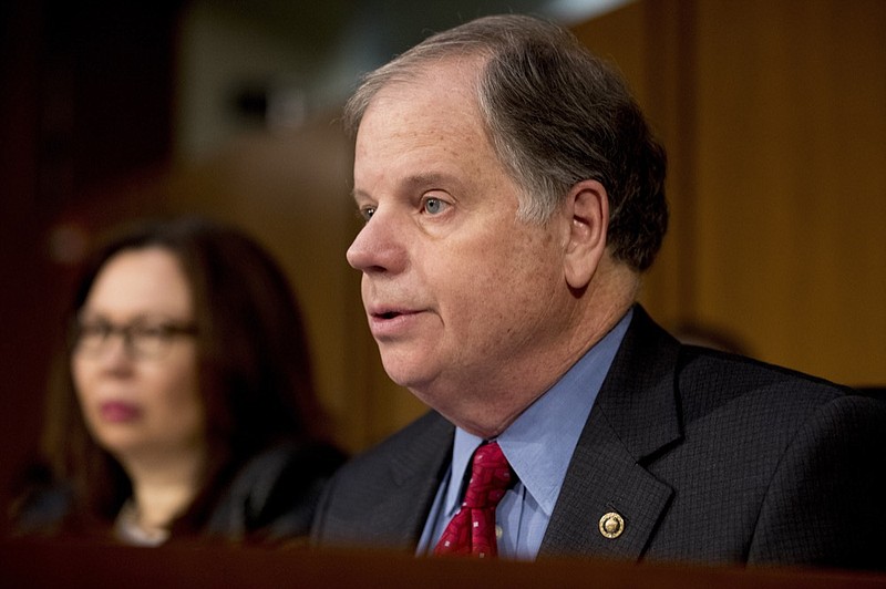 FILE - In this Feb. 5, 2019, file photo, Sen. Doug Jones, D-Ala., questions at a Senate Armed Services Committee hearing on Capitol Hill in Washington. Jones condemned Alabama's new abortion ban as "extreme" and "irresponsible" Thursday, May 16, a day after the state's Republican governor signed the most restrictive abortion measure in the country into law. (AP Photo/Andrew Harnik, File)

