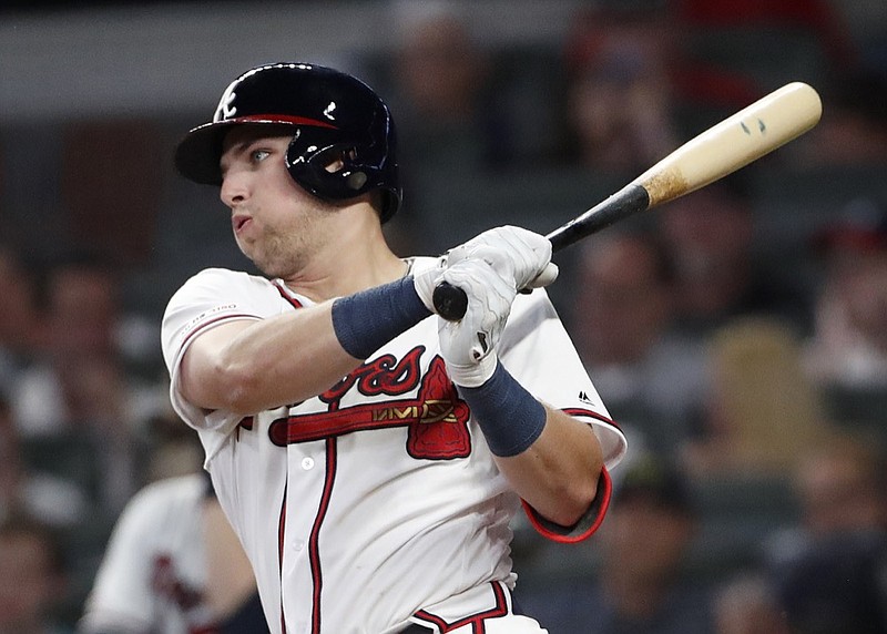 Atlanta Braves rookie Austin Riley follows through on a base hit in the fifth inning of Thursday night's home win against the St. Louis Cardinals.