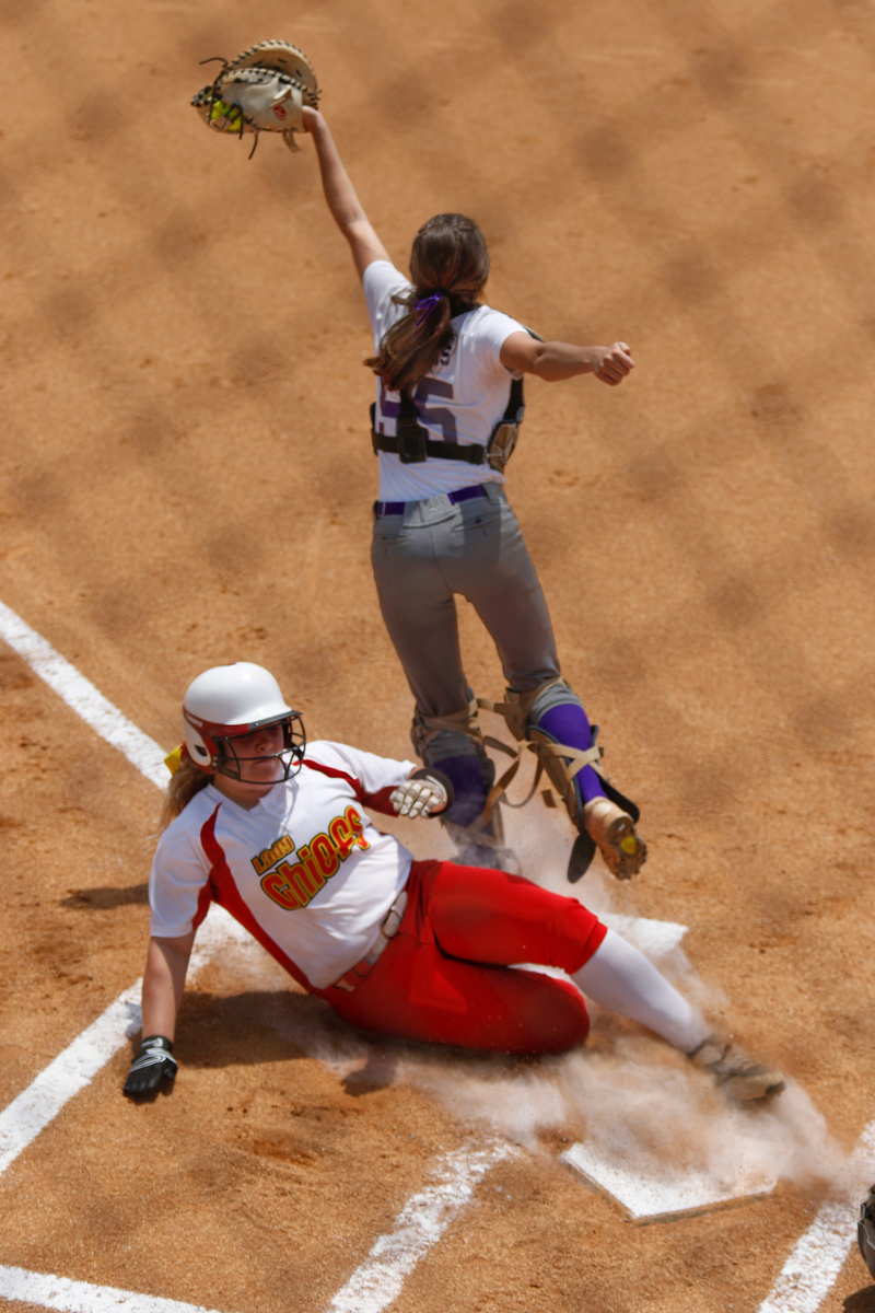 Sequoyah runner Maycee Bovard slides into home as a wild throw robs Marion County catcher Savannah Thomas of a forced out during their TSSAA softball game against Sequoyah at Marion County High School on Friday, May 17, 2019, in Chattanooga, Tenn.