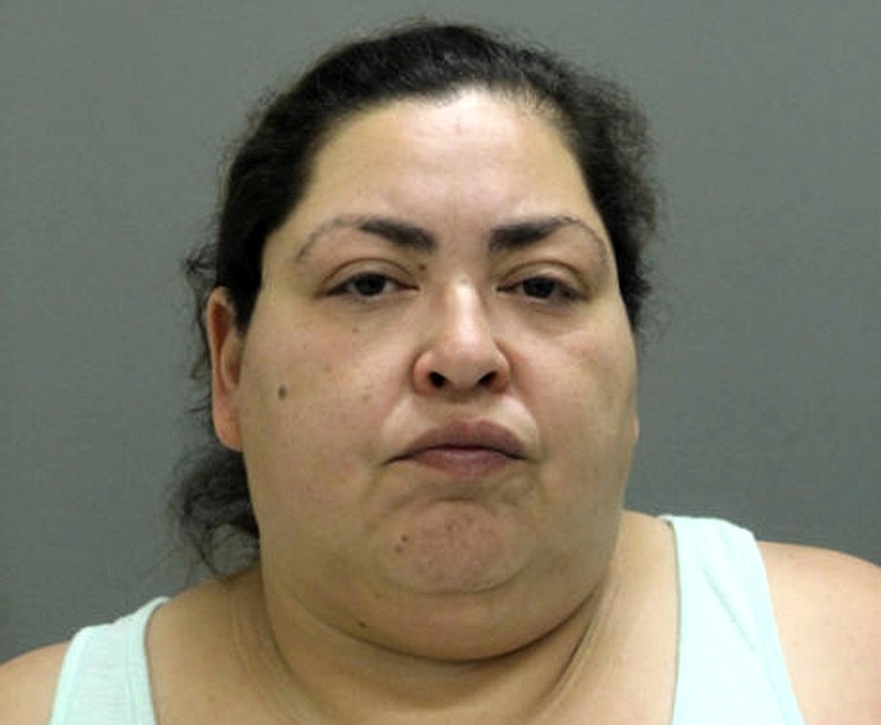 This booking photo provided by the Chicago Police Department, Thursday, May 16, 2019, shows Clarisa Figueroa, who is charged in the death of 19-year-old expectant mother Marlen Ochoa-Lopez. First-degree murder charges have been filed against Figueroa and her daughter Desiree Figueroa in connection with the death of Ochoa-Lopez, whose body was discovered earlier in the week, strangled before her baby was cut from her womb. (Chicago Police Department via AP)