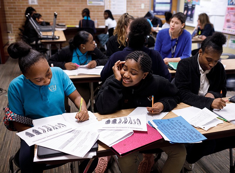 Destini Collier, left, Cuzziah Walker, center, and Talasha Jones work on an activity in their middle school science class at Chattanooga Girls Leadership Academy on Thursday, April 11, 2019, in Chattanooga, Tenn. The nationally-recognized public charter school celebrates its 10th anniversary this year.