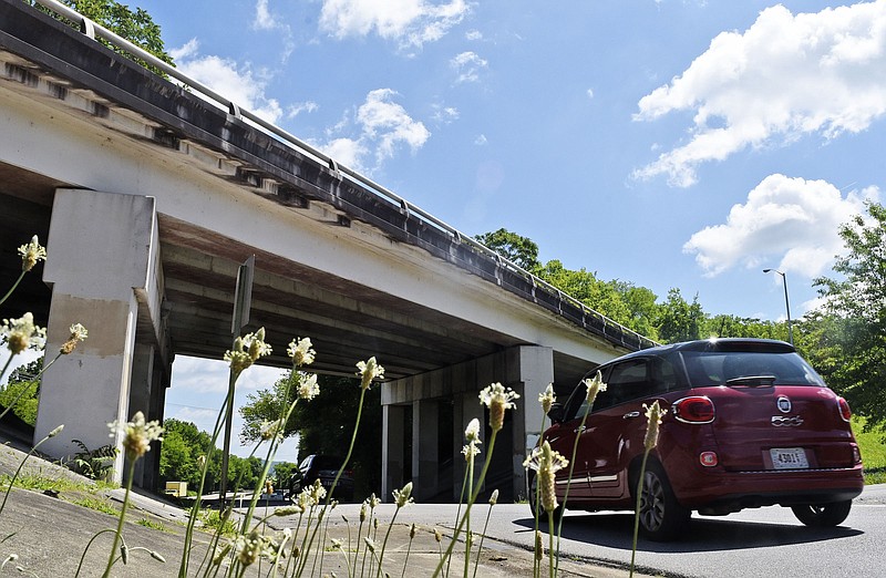 A car exits East Fourth Street to enter the ramp to Riverside Drive below the East Third Street flyover.  The Third and Fourth Street Corridor facelift is allocated in Mayor Andy Berke's proposed 2020 budget.  The area was photographed on May 20, 2019.  