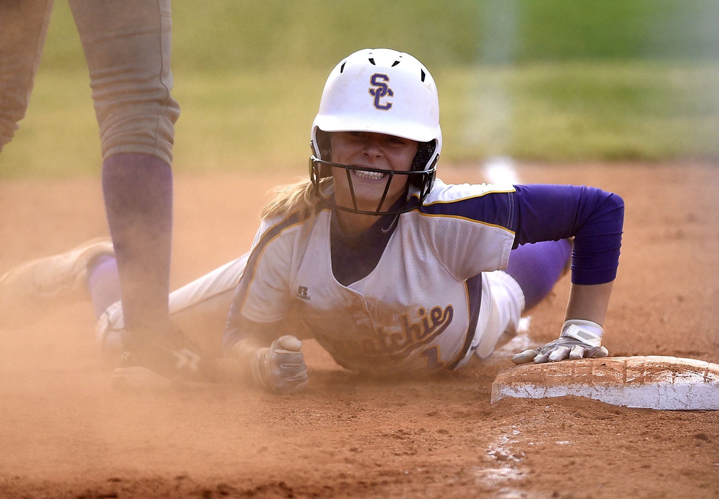 Sequatchie County's Ella Edgemon (1) smiles as he is safe at third with a three-run triple. The Marion County Lady Warriors defeated the Sequatchie County Lady Indians 6-5 in the Region 4-AA championship at Sequatchie County High on May 15, 2019.