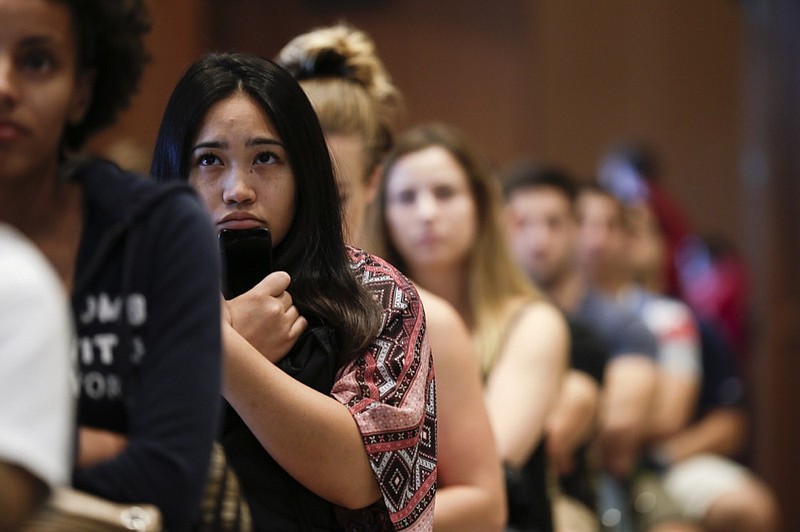 FILE - In this Friday, Aug. 1, 2014 file photo, new students at San Diego State University watch a video on sexual consent during an orientation meeting in San Diego. Just what constitutes an expression of consent is a hotly debated topic in the justice system and in society at large. And while there s been a gradual cultural trend, especially on university campuses, toward a standard of affirmative consent _ otherwise known as yes means yes rather than no means no _ the laws on sexual assault have not similarly evolved. (AP Photo/Gregory Bull)

