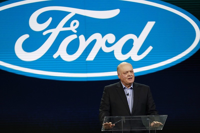 FILE - In this Jan. 14, 2018, file photo Ford President and CEO Jim Hackett prepares to address the media at the North American International Auto Show in Detroit. Ford is cutting about 7,000 white-collar jobs, which would make up 10% of its global workforce. The company has said it was undertaking a major restructuring, and on Monday, May 20, 2019, said that it will have trimmed thousands of jobs by August. In a memo to employees, Monday, Hackett said the fourth wave of the restructuring will start on Tuesday, May 21 with the majority of cuts being finished by May 24. (AP Photo/Carlos Osorio, File)

