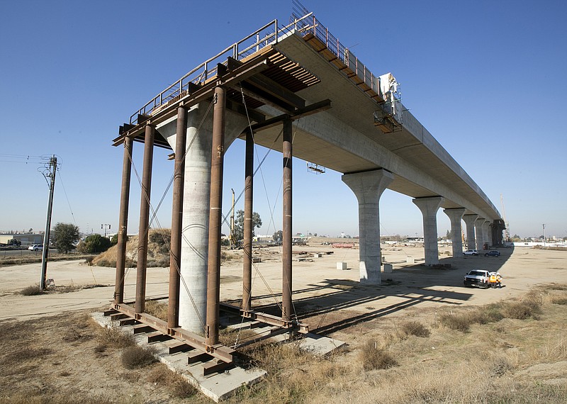 FILE - This Dec. 6, 2017, file photo shows one of the elevated sections of the high-speed rail under construction in Fresno, Calif. California has sued to block the Trump administration from cancelling nearly $1 billion for the state's high-speed rail project. The lawsuit filed Tuesday, May 21, 2019 comes after the administration revoked the funding last week. Gov. Gavin Newsom has called the move illegal and says it's political retribution for California's resistance to President Donald Trump's immigration policies. (AP Photo/Rich Pedroncelli, File)