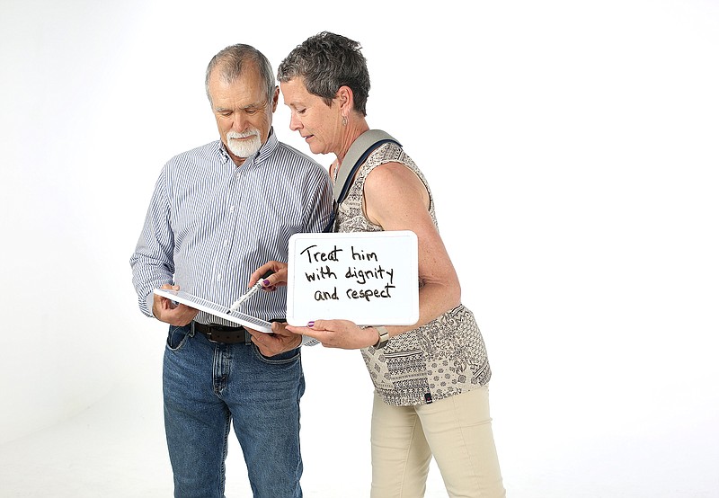 Jim Ledbetter holds his whiteboard as his wife, Katie Larue, circles the part of his answer that she agrees with after answering questions on their boards "Newlywed Game" style Wednesday, May 1, 2019 at the Chattanooga Times Free Press in Chattanooga, Tennessee. Ledbetter and Larue have been married for two years and have known each other for 22 years.