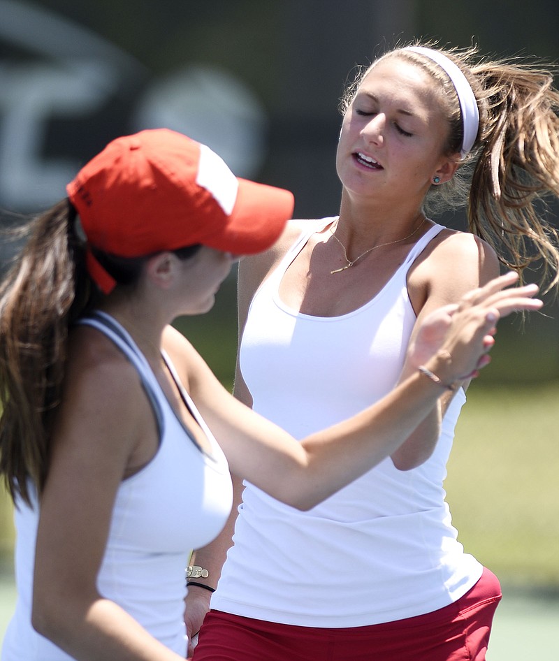 Baylor's Defne Bozbey, left, and Landie McBrayer celebrate a point over Girls Preparatory School's Mary Kate Johnson and Barbie Edwards, not pictured, during the TSSAA Division II-AA girls' tennis team state tournament Tuesday at the Adams Tennis Complex in Murfreesboro.