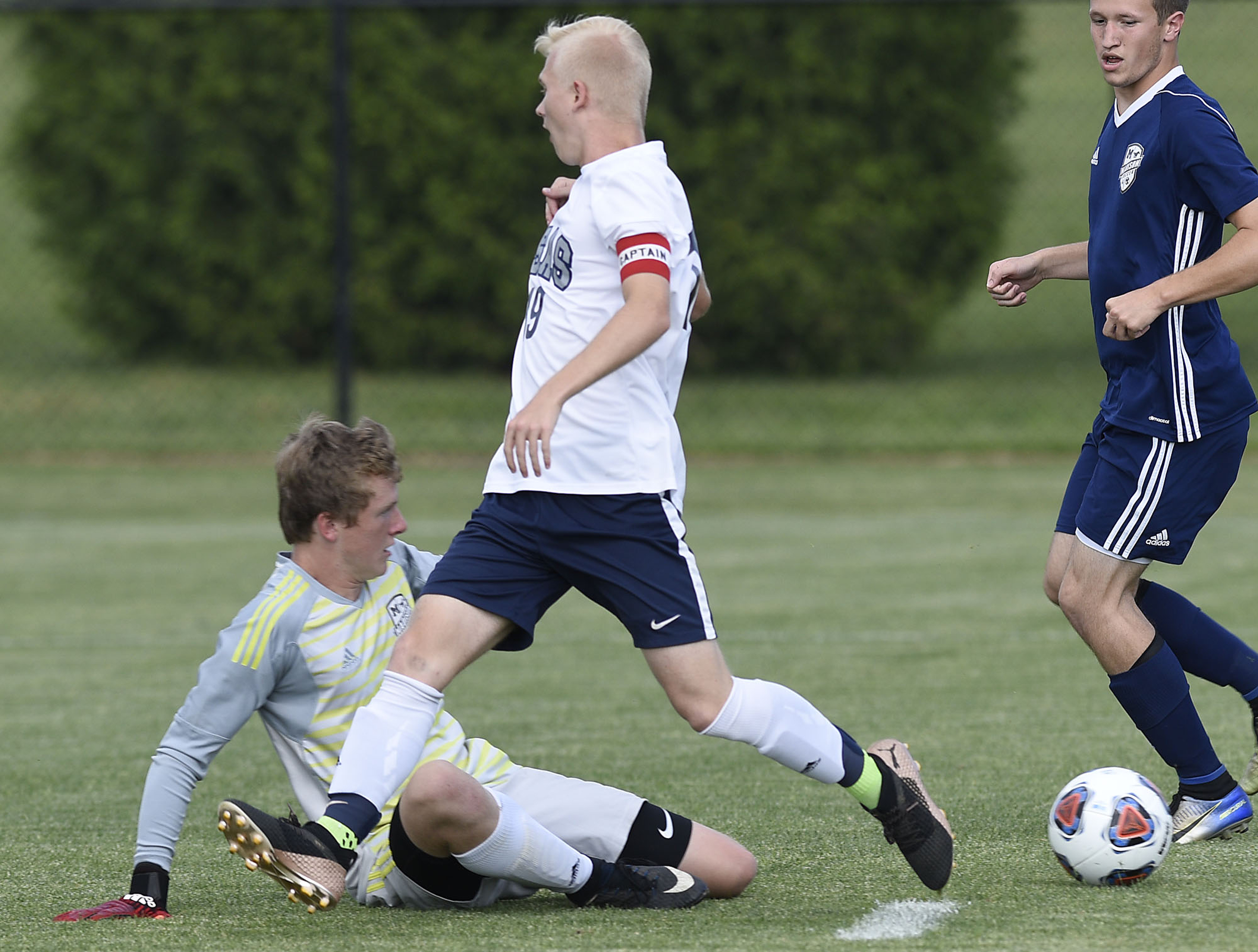 CSAS's James Badger (19) has the ball knocked away by Madison's goalkeeper. The TSSAA Class A Soccer Tournament was held at Siegel Park in Murfreesboro on May 21, 2019.