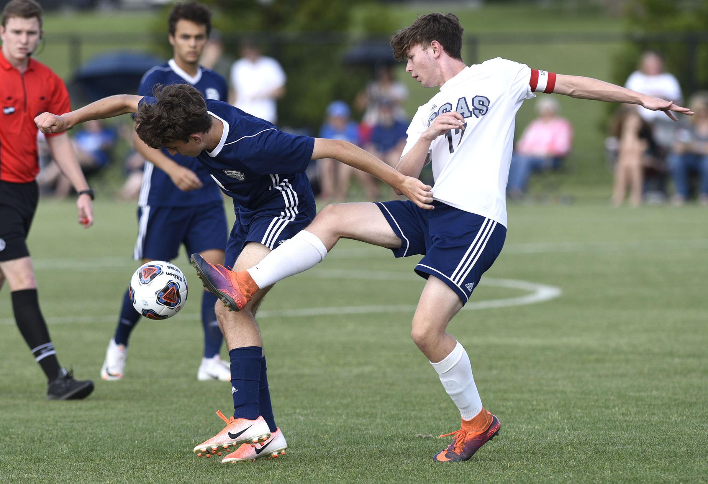 CSAS's Asa Nichols (17) kicks the ball away from a Madison player. The TSSAA Class A Soccer Tournament was held at Siegel Park in Murfreesboro on May 21, 2019.