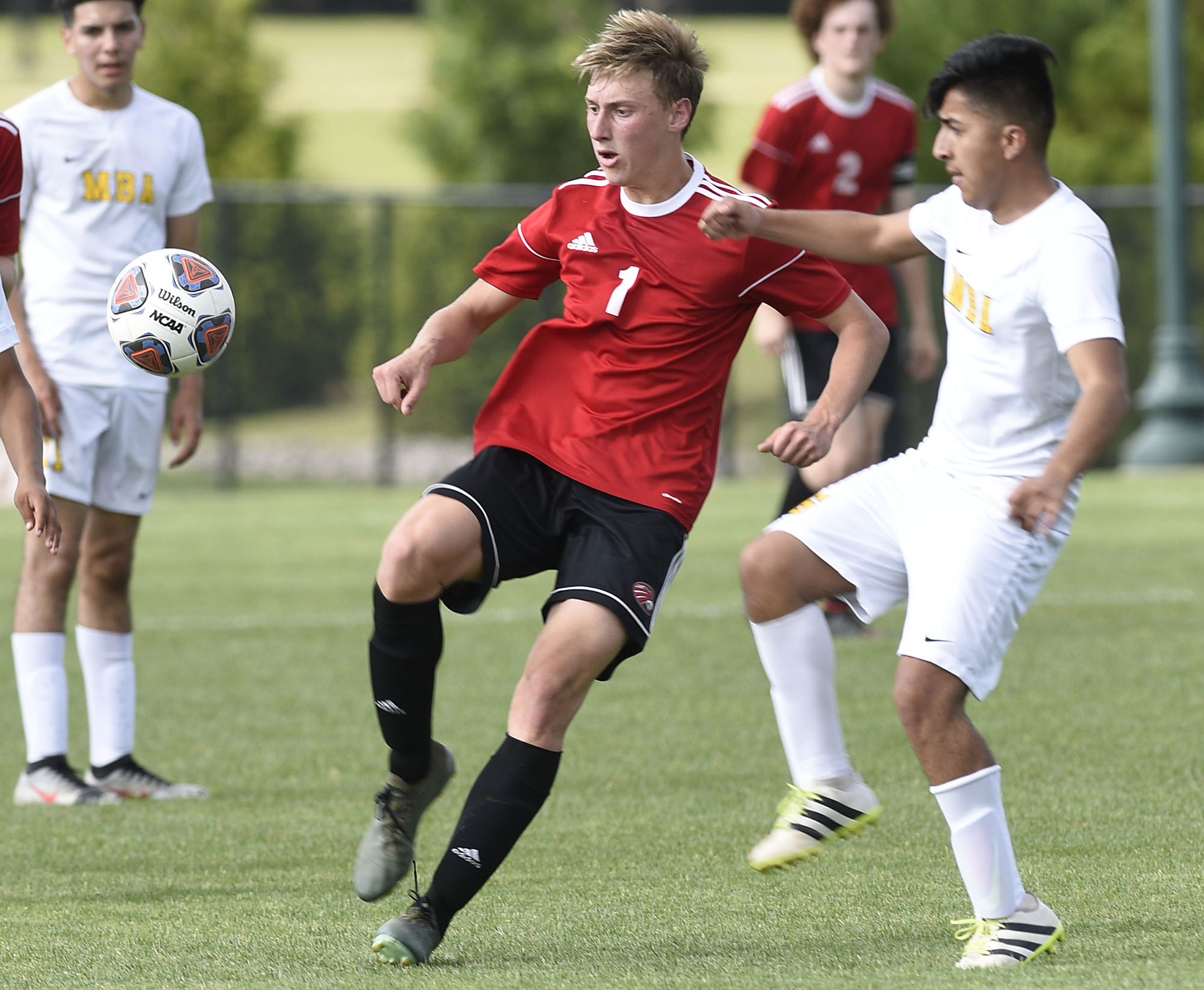 Signal Mountain's George Coogan (1) keeps the ball away from a MBA defender. The TSSAA Division II Soccer Tournament was held at Siegel Park in Murfreesboro on May 21, 2019.