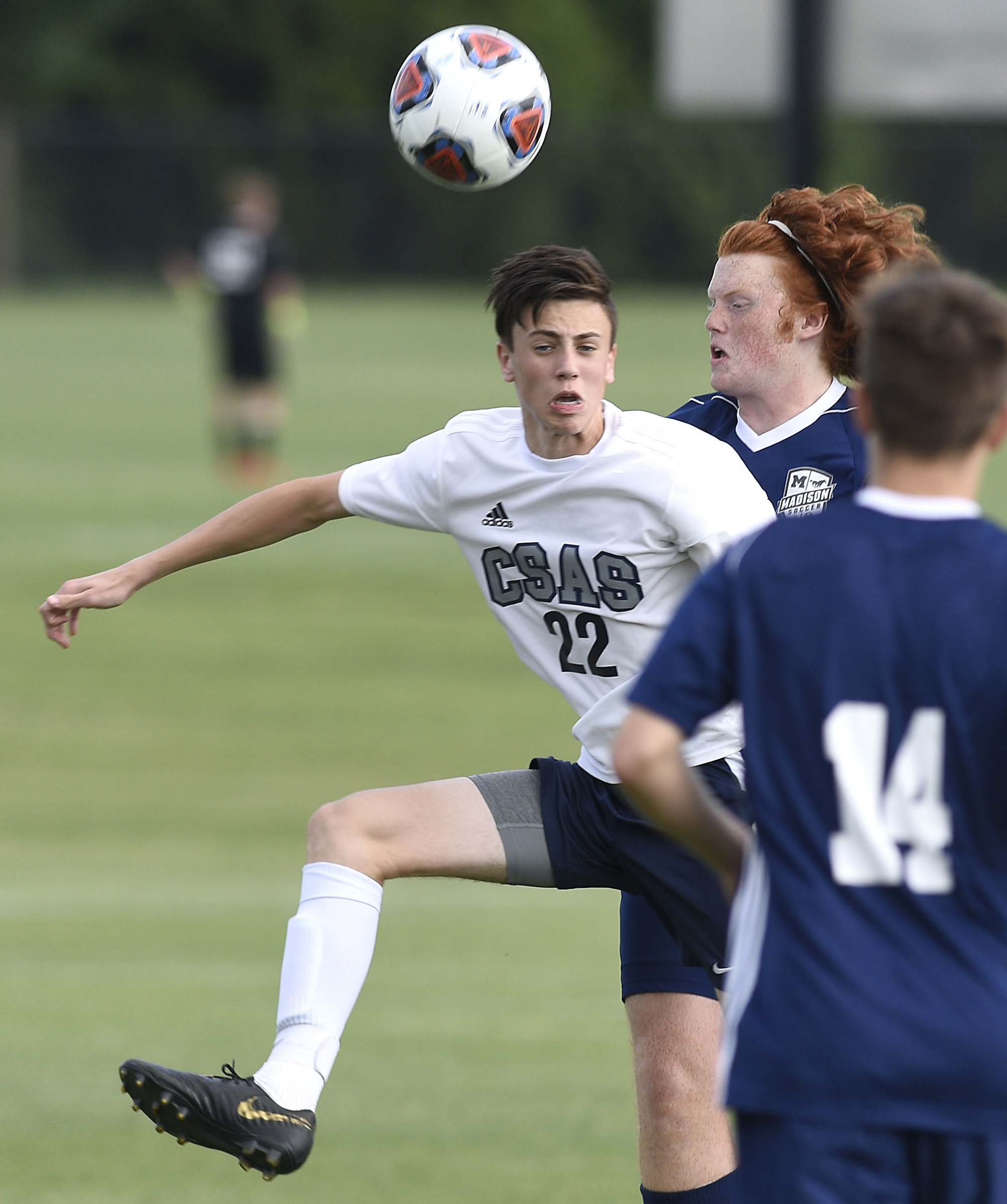 CSAS's Adin Castle (22) heads the ball between Madison players. The TSSAA Class A Soccer Tournament was held at Siegel Park in Murfreesboro on May 21, 2019.