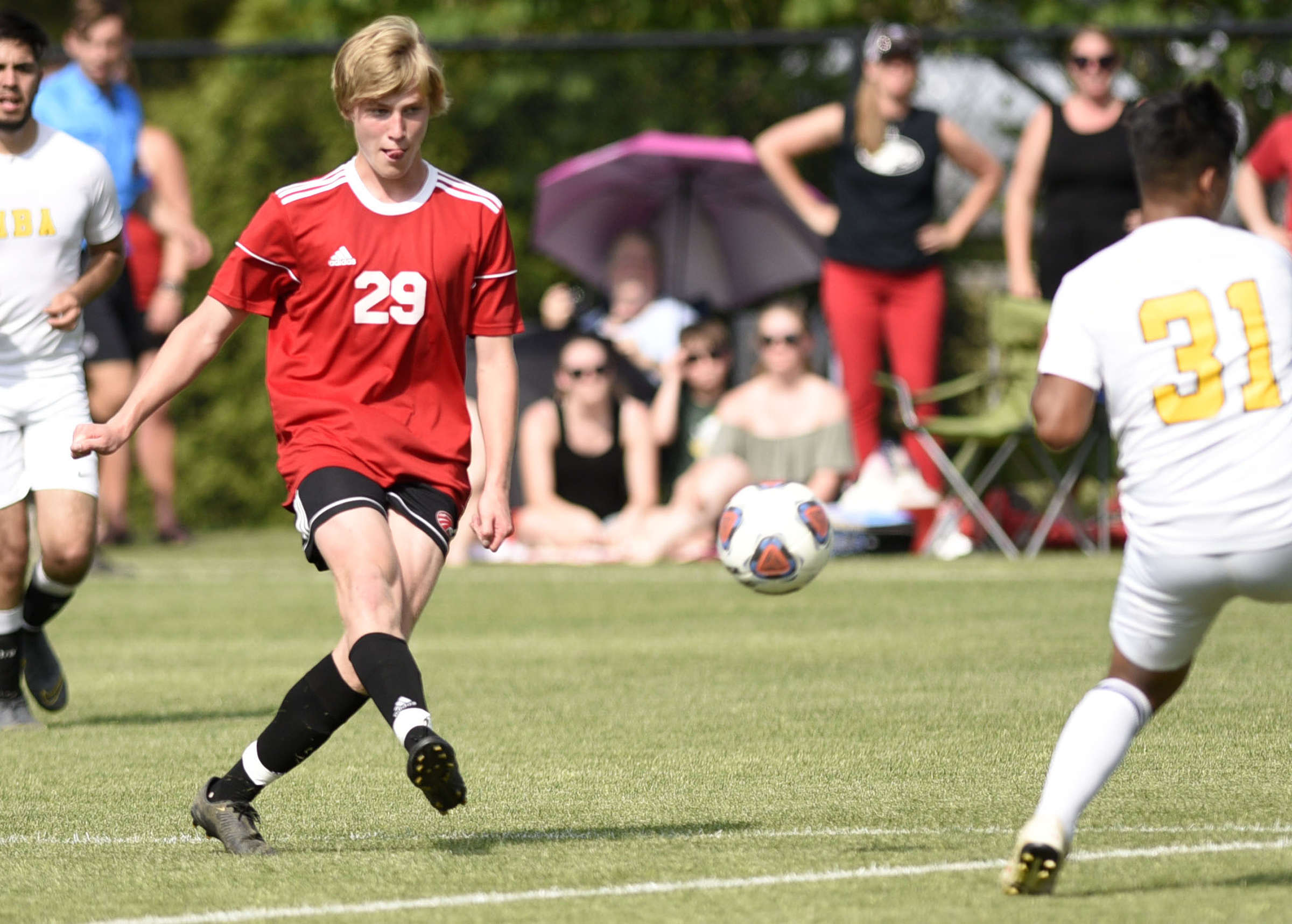 Signal Mountain's Tristan Santelmann (29) kicks the ball into the Memphis Business Academy zone. The TSSAA Class A Soccer Tournament was held at Siegel Park in Murfreesboro on May 21, 2019.