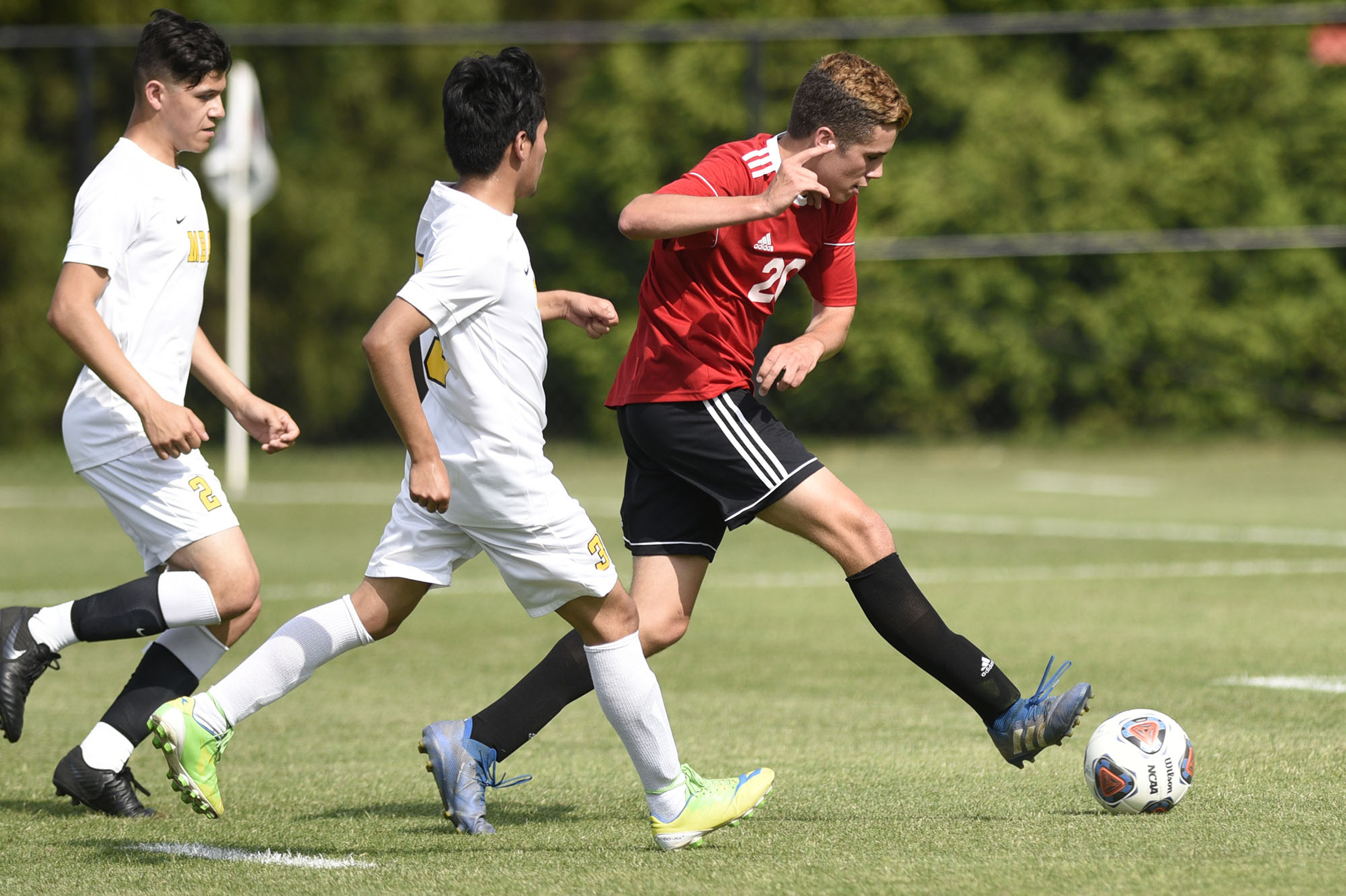 Signal Mountain's Clay Gallant (20) breaks free of two MBA defenders to score the Eagles's first goal. The TSSAA Class A Soccer Tournament was held at Siegel Park in Murfreesboro on May 21, 2019.