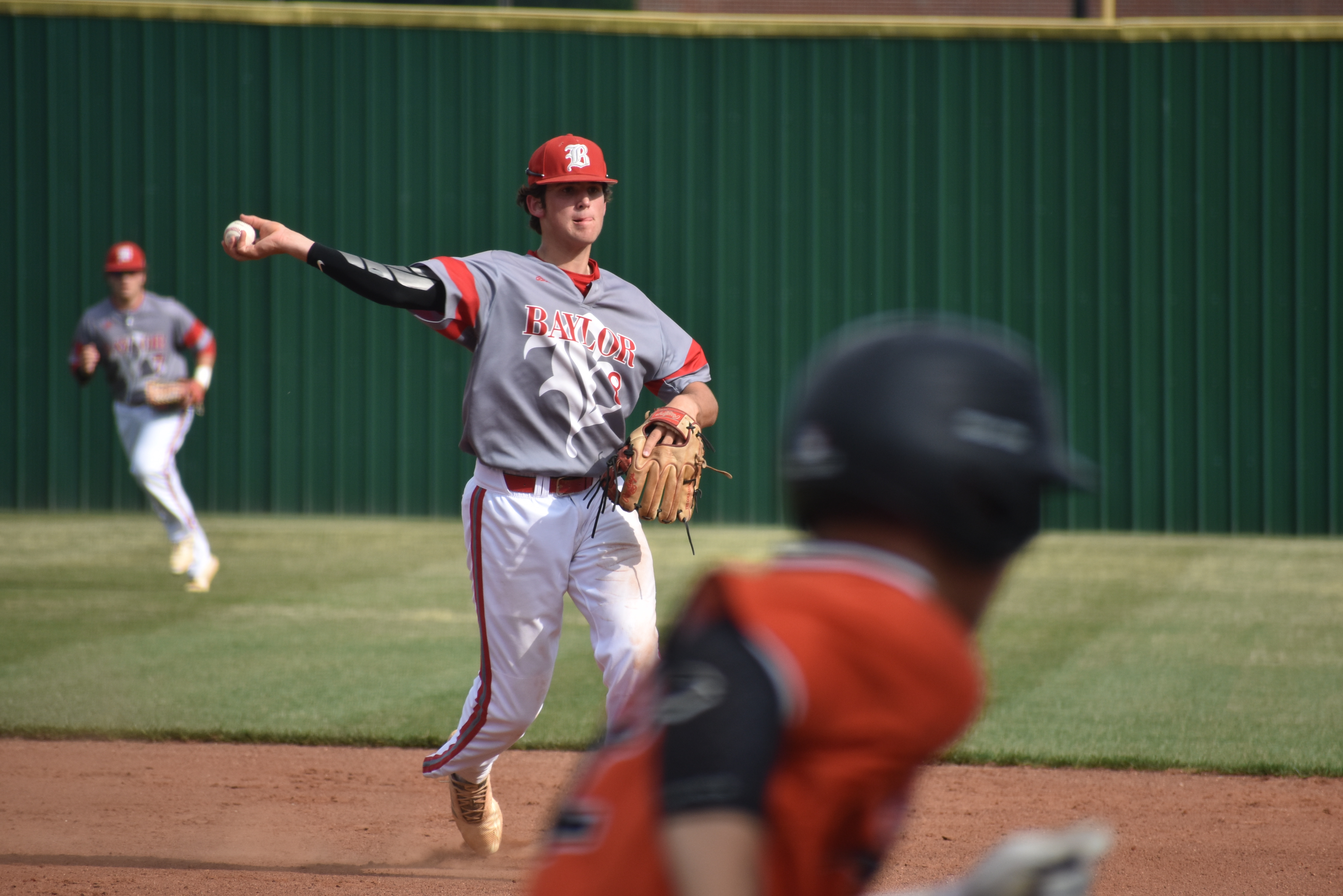 Baylor sophomore Cooper Kinney makes a throw to first in Baylor's red-hot start to the Spring Fling. The Red Raiders beat Ensworth 10-0 in five innings at Wilson Central High School on Tuesday.