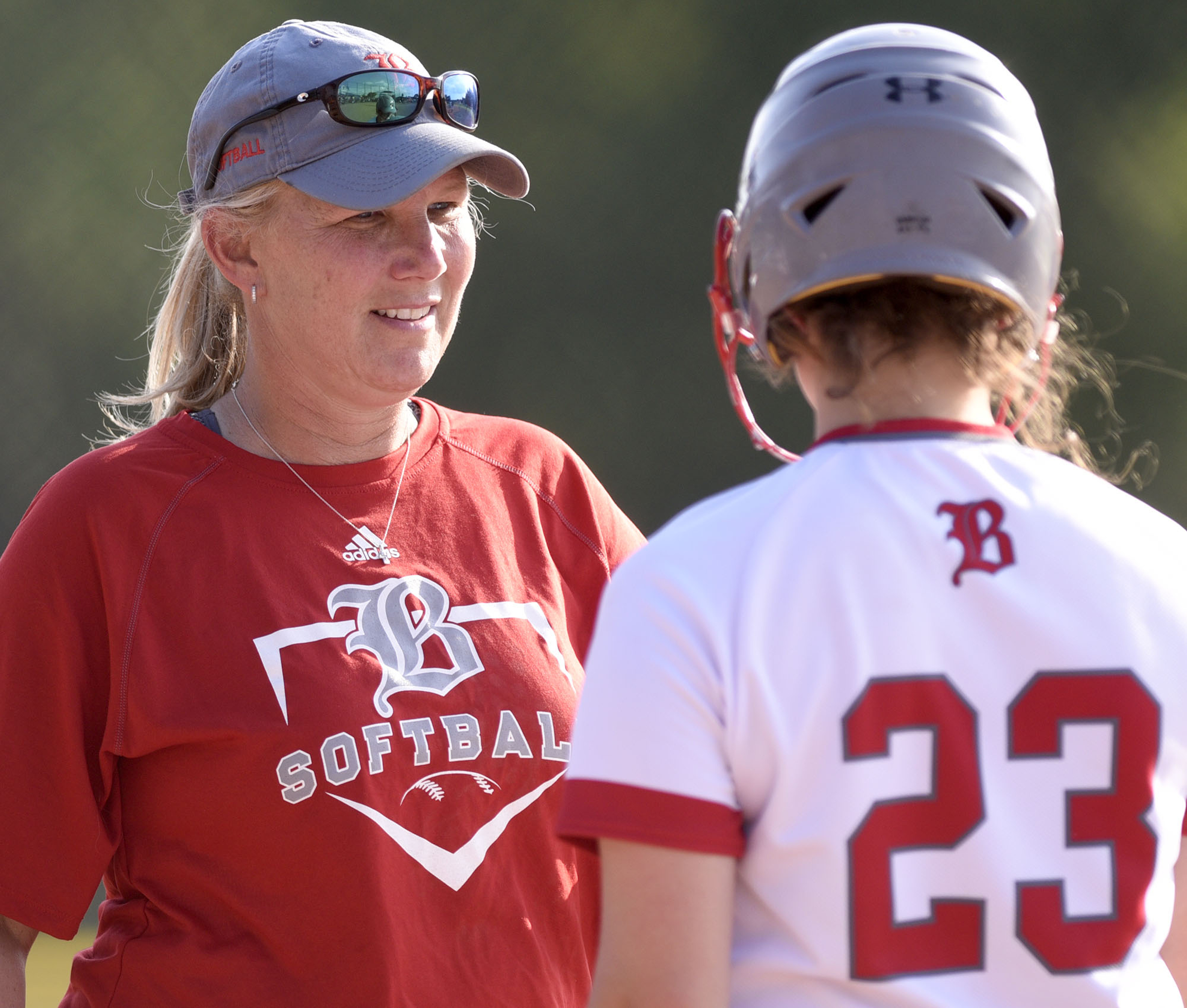 Baylor head coach Kelli Smith confers with Sophe Piskos (23). The TSSAA Softball Tournament was held at the Starplex in Murfreesboro on May 21, 2019.