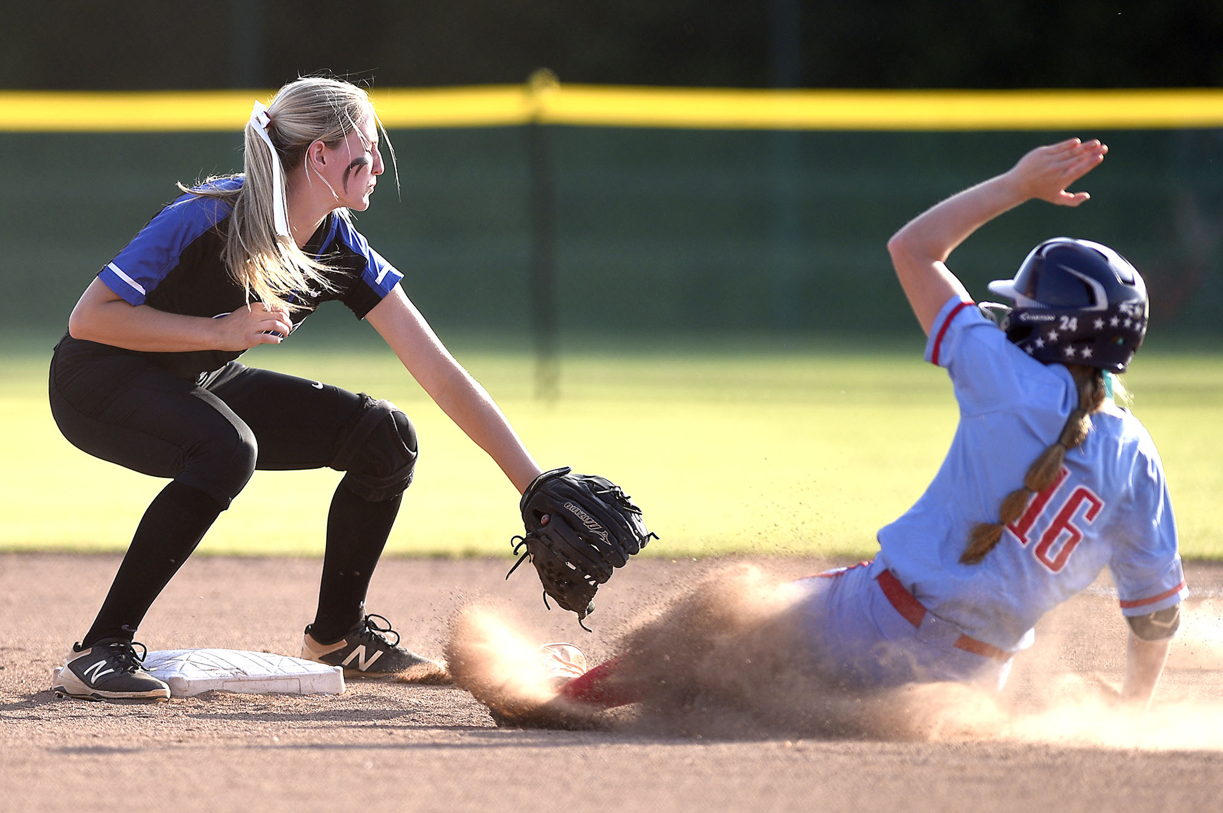 St.Benedict's Neely Taylor (16) is safe at second as GPS's Kaitlyn Songer (11) awaits the throw. GPS faced St. Benedict in Class AA bracket. The TSSAA Softball Tournament was held at the Starplex in Murfreesboro on May 21, 2019.