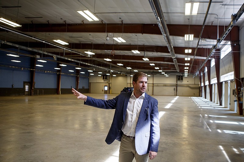 Team Title Services CEO Web Raulston gives a tour of the company's future 
offices at the site of the former Alstom plant on Riverfront Parkway.