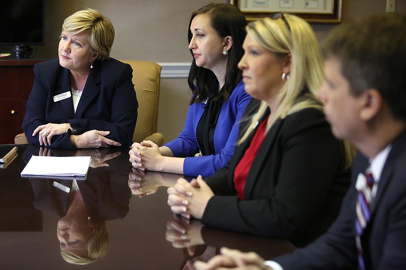 Patti Steele, president and chief executive officer of First Volunteer Bank, sits at the head of the table with other bank executives during an interview at First Volunteer Bank headquarters Monday, May 13, 2019 in Chattanooga, Tennessee. Megan Cassell, chief financial officer, Trish Phillips, executive vice president and director of retail banking, and Jeremy Dean, executive vice president of business banking, sit along side Steele.