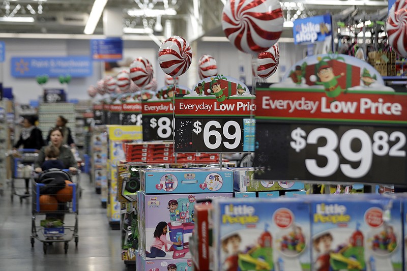 FILE - This Oct. 26, 2016, file photo, shows prices in the toy section at Walmart in Teterboro, N.J.  An escalating trade war with China could mean higher prices on a broad array of products from toys to clothing. But some retailers will feel more pain than others, further deepening the divide between the winners and the losers that was evident in the latest earnings reports. Analysts say big box giants like Walmart and Target, which have had strong performances, are best positioned to absorb the higher costs because of their clout with suppliers. (AP Photo/Julio Cortez, File)