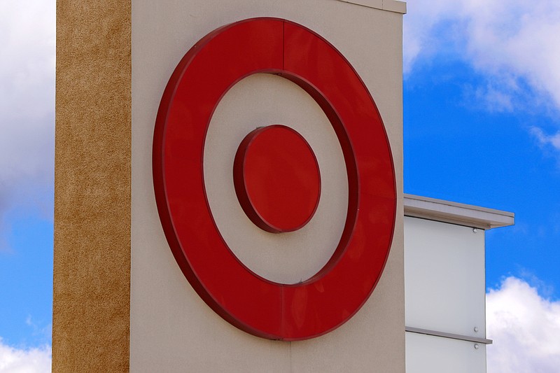 FILE- This May 3, 2017, file photo shows the Target logo on a store in Upper Saint Clair, Pa. An aggressive campaign at Target to let customers do more online is paying off. The retailer on Wednesday, May 22, 2019, exceeded first quarter expectations on just about every level, saying the same day services it's rolled out in recent years drove more than 25 percent of comparable sales growth.  (AP Photo/Gene J. Puskar, File)